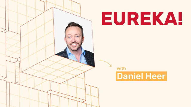 Eureka! with Daniel Heer, featuring a smiling man's portrait on a cube amidst a 3D block design.