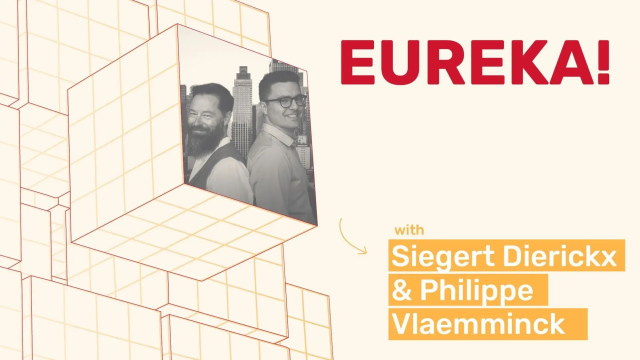 Siegert Dierickx & Philippe Vlaemminck smiling, city skyline background, "EUREKA!"